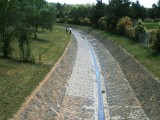 A stone and concrete waterway in Canberra. Stone mason unknown.